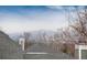 Rooftop view of distant mountains and low-lying clouds at 1296 Ascot Ave, Highlands Ranch, CO 80126