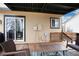 Outdoor porch area with sliding glass door entry and view of the fenced backyard at 1296 Ascot Ave, Highlands Ranch, CO 80126