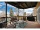 Covered porch featuring comfortable seating and a grill for outdoor enjoyment at 1296 Ascot Ave, Highlands Ranch, CO 80126