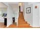 Stairway with hardwood treads and white risers ascending to the second floor at 1296 Ascot Ave, Highlands Ranch, CO 80126