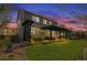Backyard with a spacious lawn, patio under a pergola, with seating and a dining area at 7665 Grady Cir, Castle Rock, CO 80108