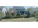 Scenic view of the backyard, showcasing mature trees, a fenced-in lawn, and a charming pergola at 7665 Grady Cir, Castle Rock, CO 80108