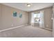 Cozy bedroom with large window, neutral walls, and plush carpet at 7665 Grady Cir, Castle Rock, CO 80108