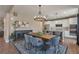 Cozy dining area adjacent to kitchen with modern chandelier and stainless steel appliances at 7665 Grady Cir, Castle Rock, CO 80108