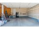 Spacious garage featuring built-in shelving and ample storage space for vehicles and equipment at 7665 Grady Cir, Castle Rock, CO 80108