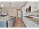 Spacious kitchen featuring a large island with granite countertops and stainless steel appliances at 7665 Grady Cir, Castle Rock, CO 80108