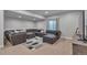 Basement living room with plush seating and ambient lighting, perfect for relaxation and entertainment at 7665 Grady Cir, Castle Rock, CO 80108