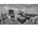 Relaxing basement living room with a large sectional, media setup, and fitness area for entertainment and exercise at 7665 Grady Cir, Castle Rock, CO 80108