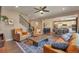 Open-concept living room featuring hardwood floors and comfortable leather seating at 7665 Grady Cir, Castle Rock, CO 80108