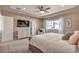 Relaxing main bedroom with a large window, TV, and dresser for ample storage at 7665 Grady Cir, Castle Rock, CO 80108