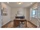 Dedicated office space with natural light, desk, and french doors at 7665 Grady Cir, Castle Rock, CO 80108