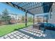 Inviting outdoor patio with a pergola, comfortable seating, and manicured lawn at 7665 Grady Cir, Castle Rock, CO 80108