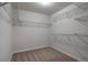 Empty walk-in closet with plenty of wire rack shelving and carpeted floors at 7665 Grady Cir, Castle Rock, CO 80108