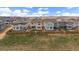 Aerial view of the house in the neighborhood with a fenced yard at 14268 Hop Clover Trl, Parker, CO 80134