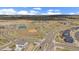Aerial view of neighborhood amenities: ball field, tennis courts, and playground at 14268 Hop Clover Trl, Parker, CO 80134
