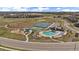 Overhead image shows a community park featuring a pool, sport courts, playground and open green space for the community at 14268 Hop Clover Trl, Parker, CO 80134