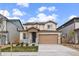 Charming two-story home with a well-manicured lawn, gray stone accents, and a two-car garage at 14268 Hop Clover Trl, Parker, CO 80134