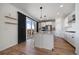 Modern kitchen with a center island, stainless steel appliances, and access to an outdoor deck at 14268 Hop Clover Trl, Parker, CO 80134
