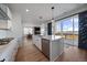 Open kitchen with white cabinets, stainless steel appliances, and access to an outdoor balcony at 14268 Hop Clover Trl, Parker, CO 80134