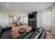 Inviting living room with fireplace, hardwood floors, and open concept design at 14268 Hop Clover Trl, Parker, CO 80134