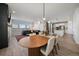 Open-concept living space with dining area and kitchen featuring modern finishes and ample natural light at 14268 Hop Clover Trl, Parker, CO 80134