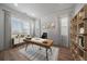 Bright office with modern desk, stylish bookcase, and plenty of natural light at 14268 Hop Clover Trl, Parker, CO 80134