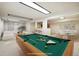 Virtually staged basement recreation area with pool table at 2695 S Ammons Way, Lakewood, CO 80227