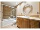 Bathroom with a bathtub, tile flooring and wood vanity at 2695 S Ammons Way, Lakewood, CO 80227