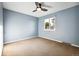 Spacious bedroom with light blue walls and carpet flooring at 2695 S Ammons Way, Lakewood, CO 80227