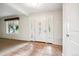 Bright entryway with tiled floor, white door, and large window at 2695 S Ammons Way, Lakewood, CO 80227