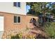 Brick walkway leading to the entrance of a home with landscaping at 2695 S Ammons Way, Lakewood, CO 80227