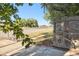 View of the front yard and wooden gate at 2695 S Ammons Way, Lakewood, CO 80227