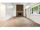 Living room with stone fireplace and built-in shelving at 2695 S Ammons Way, Lakewood, CO 80227