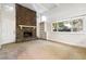 Living room with stone fireplace and built-in shelving at 2695 S Ammons Way, Lakewood, CO 80227