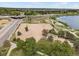 An aerial shot features a large open field, lake, and surrounding greenery, creating a serene and picturesque scene at 4712 Perry St, Denver, CO 80212