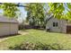 Landscaped backyard offering a well-maintained lawn, a shed, and a patio with a grill at 4712 Perry St, Denver, CO 80212