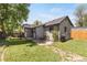 Picturesque backyard with patio, grill and lush lawn at 4712 Perry St, Denver, CO 80212