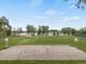 Outdoor basketball court on a well-maintained lawn with a view of the lake at 4712 Perry St, Denver, CO 80212