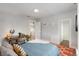 Bright bedroom featuring a modern desk, closet, and a light neutral wall color at 4712 Perry St, Denver, CO 80212