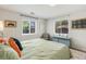Relaxing bedroom with calming colors, large windows, and contemporary accents at 4712 Perry St, Denver, CO 80212