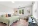 Bright bedroom with a comfortable bed, stylish decor, and plenty of natural light at 4712 Perry St, Denver, CO 80212