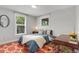 Cozy bedroom features a modern desk, ample natural light, and stylish decor at 4712 Perry St, Denver, CO 80212
