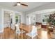 Open-concept dining area featuring hardwood floors and seamless flow to other living spaces at 4712 Perry St, Denver, CO 80212