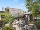 Charming restaurant exterior showcasing outdoor seating and a garden with fountain at 4712 Perry St, Denver, CO 80212