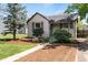 Charming single-Gathering home featuring a well-maintained front yard with mature landscaping and inviting curb appeal at 4712 Perry St, Denver, CO 80212