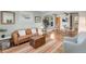 Cozy living room featuring hardwood floors, a comfortable leather sofa, and stylish decor at 4712 Perry St, Denver, CO 80212