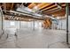 Spacious unfinished basement with utilities, exposed ceiling, and potential for future customization at 7426 E 148Th Pl, Thornton, CO 80602