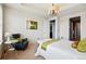 Airy bedroom boasts a comfortable layout, a view into the hall, and neutral decor at 7426 E 148Th Pl, Thornton, CO 80602