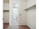 Spacious walk-in closet with a laundry room view, offering convenient storage solutions at 7426 E 148Th Pl, Thornton, CO 80602