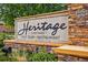 Elegant community sign for Heritage Todd Creek Golf Club and Restaurant with landscaping at 7426 E 148Th Pl, Thornton, CO 80602